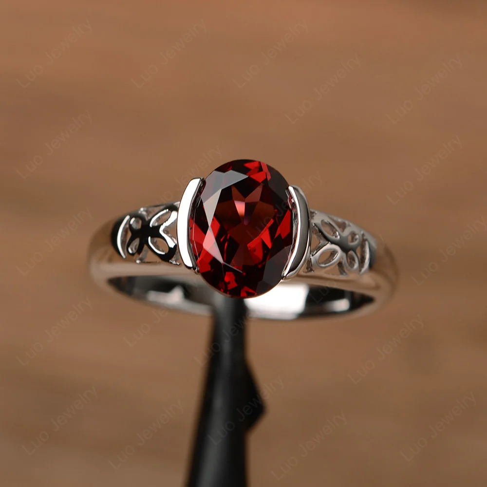 Oval Garnet Bezel Set Engagement Ring