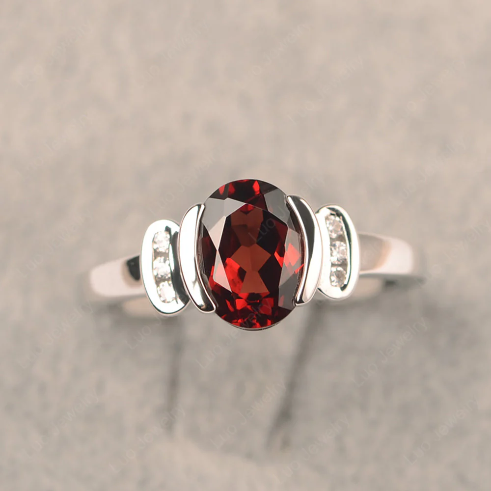 Oval Garnet Half Bezel Engagement Ring