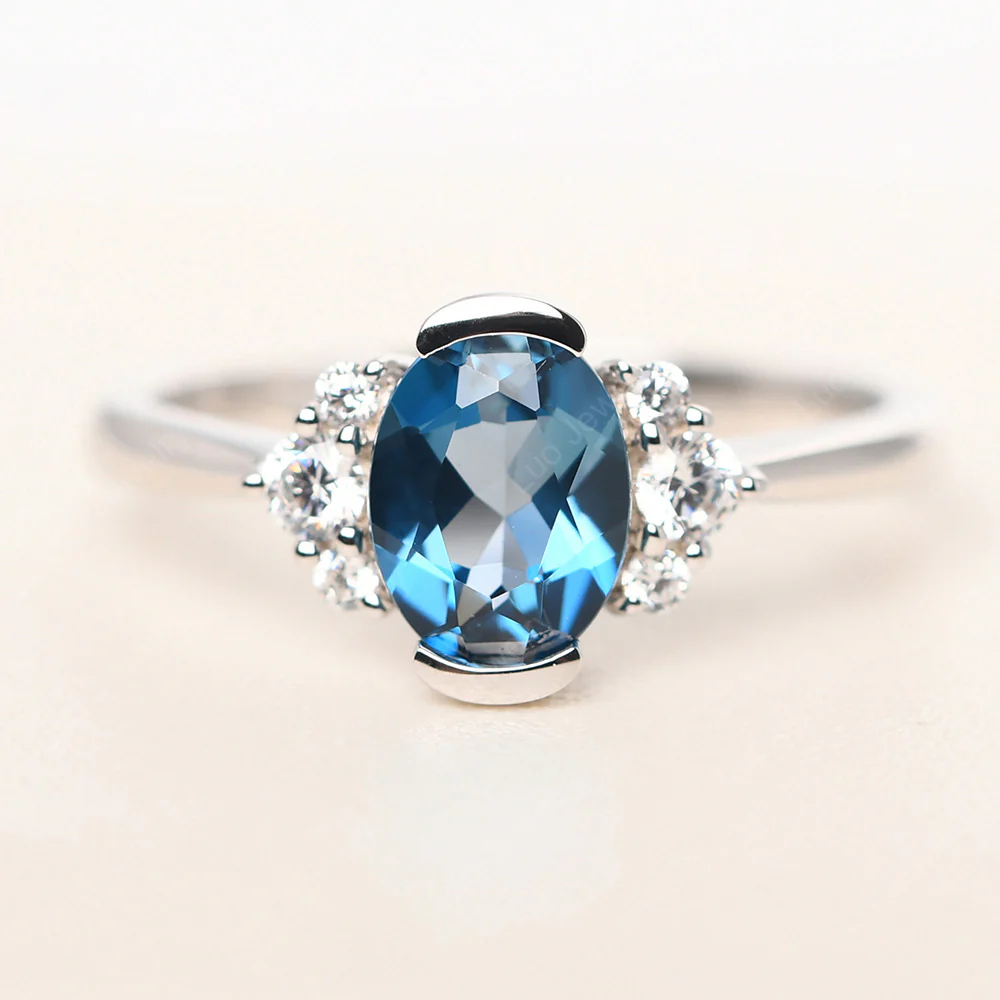 Oval Half Bezel Set London Blue Topaz Engagement Ring