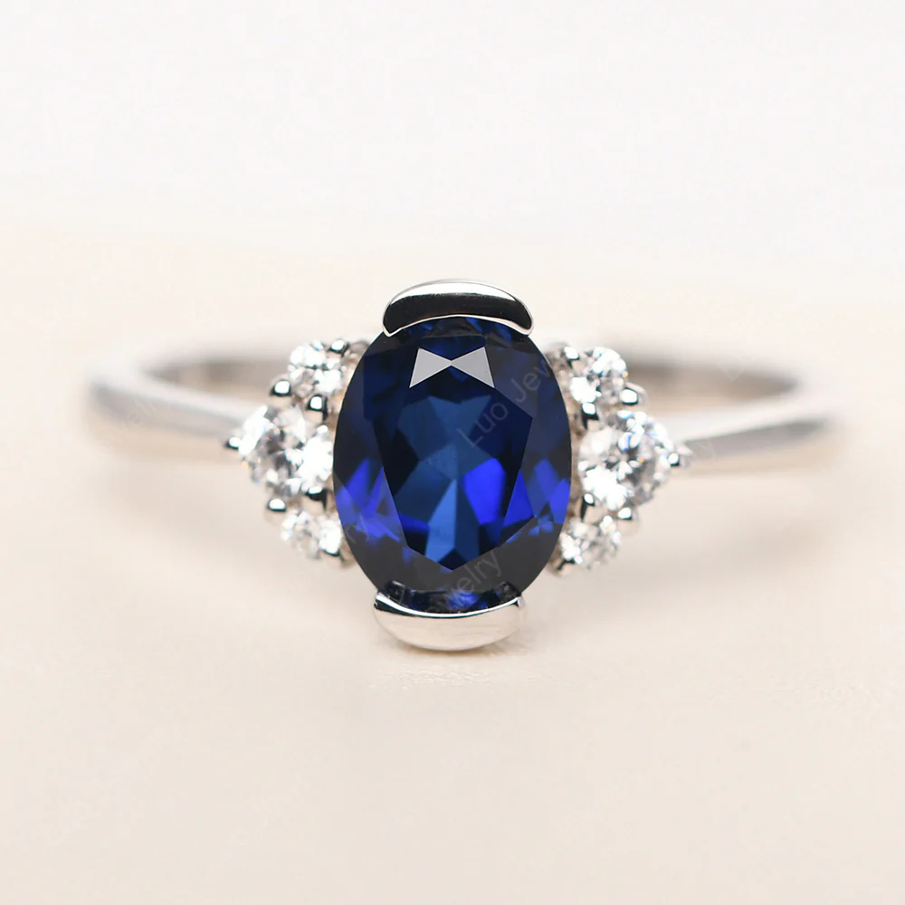 Oval Half Bezel Set Sapphire Engagement Ring
