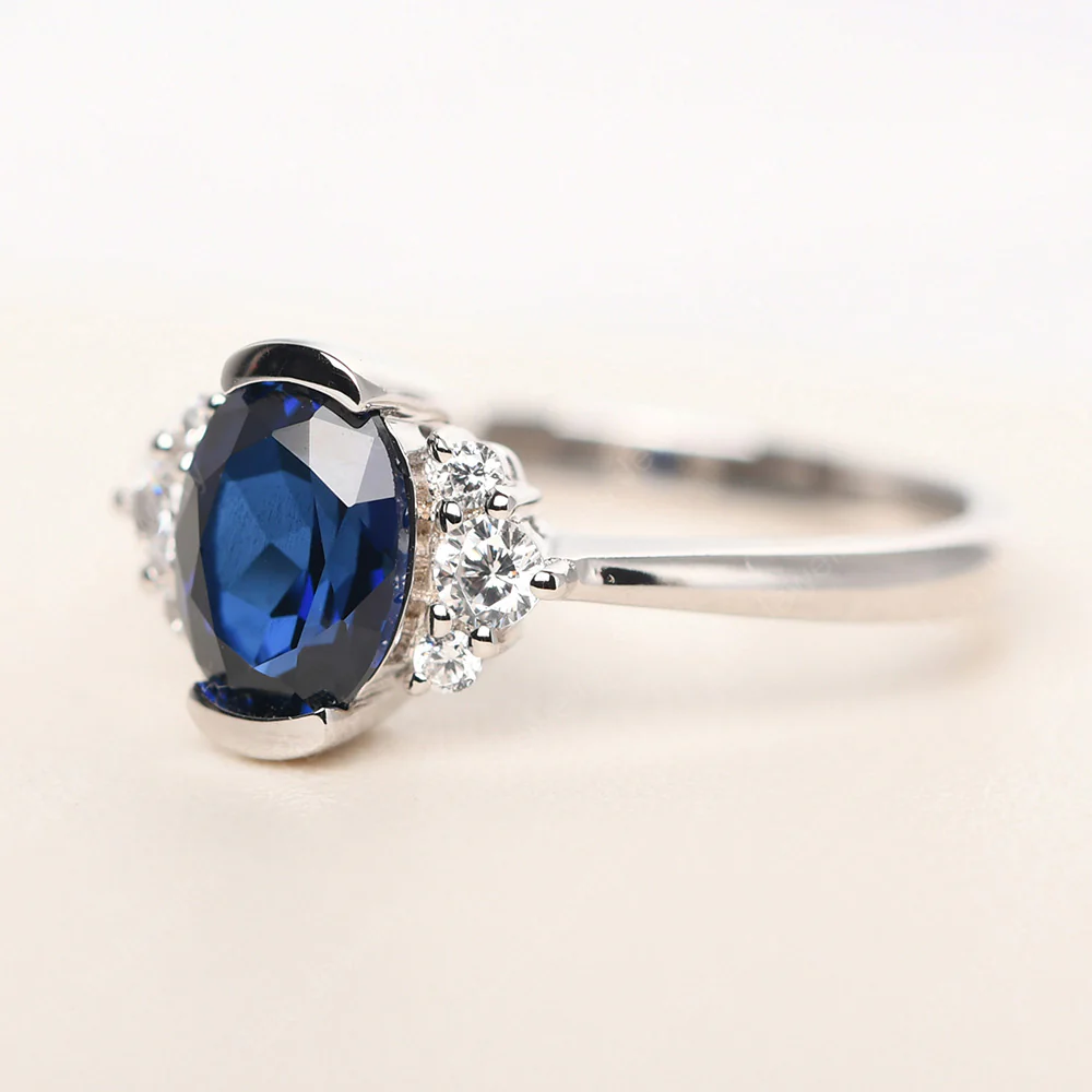 Oval Half Bezel Set Sapphire Engagement Ring - Image 2
