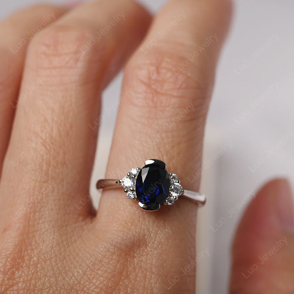 Oval Half Bezel Set Sapphire Engagement Ring - Image 5