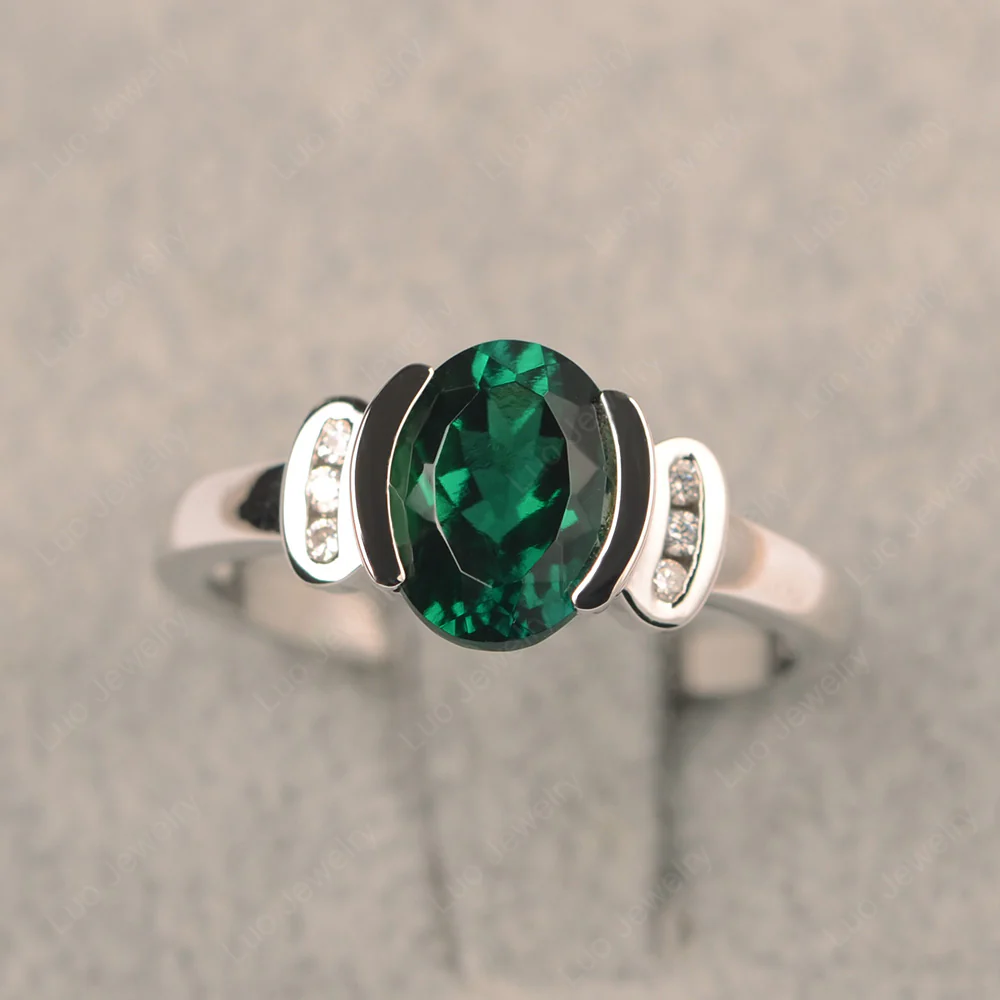 Oval Emerald Half Bezel Engagement Ring