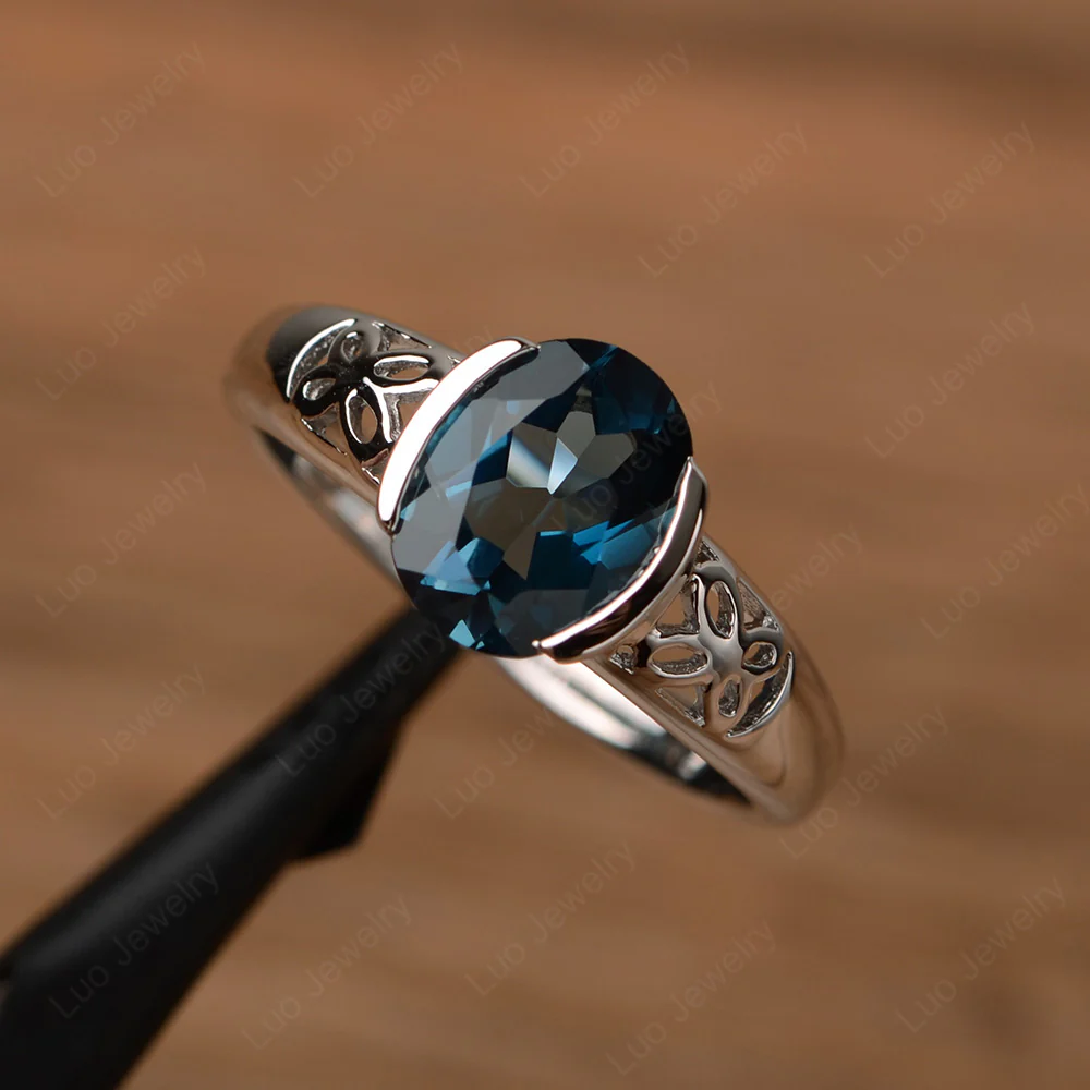 Oval London Blue Topaz Bezel Set Engagement Ring