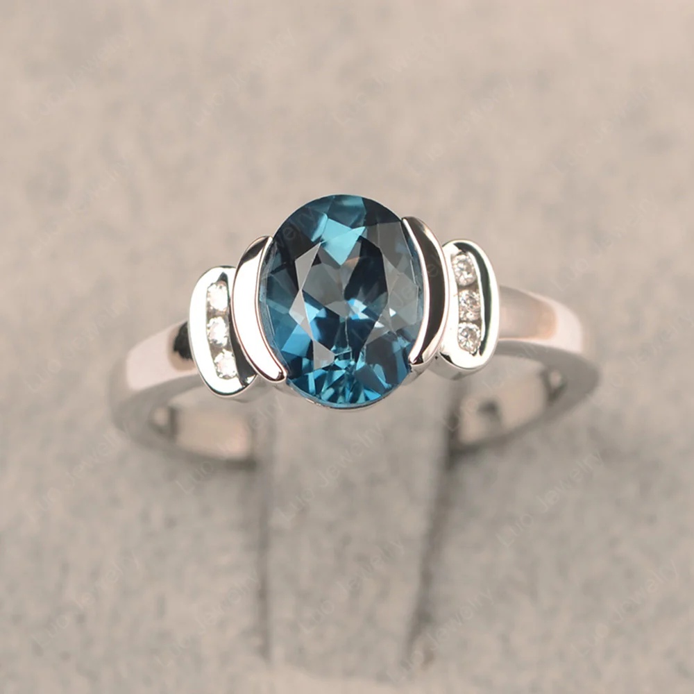 Oval London Blue Topaz Half Bezel Engagement Ring