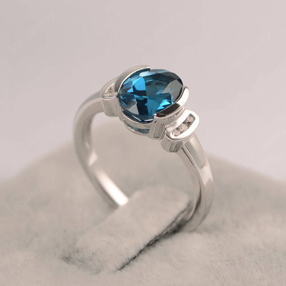 Oval London Blue Topaz Half Bezel Engagement Ring - Image 3