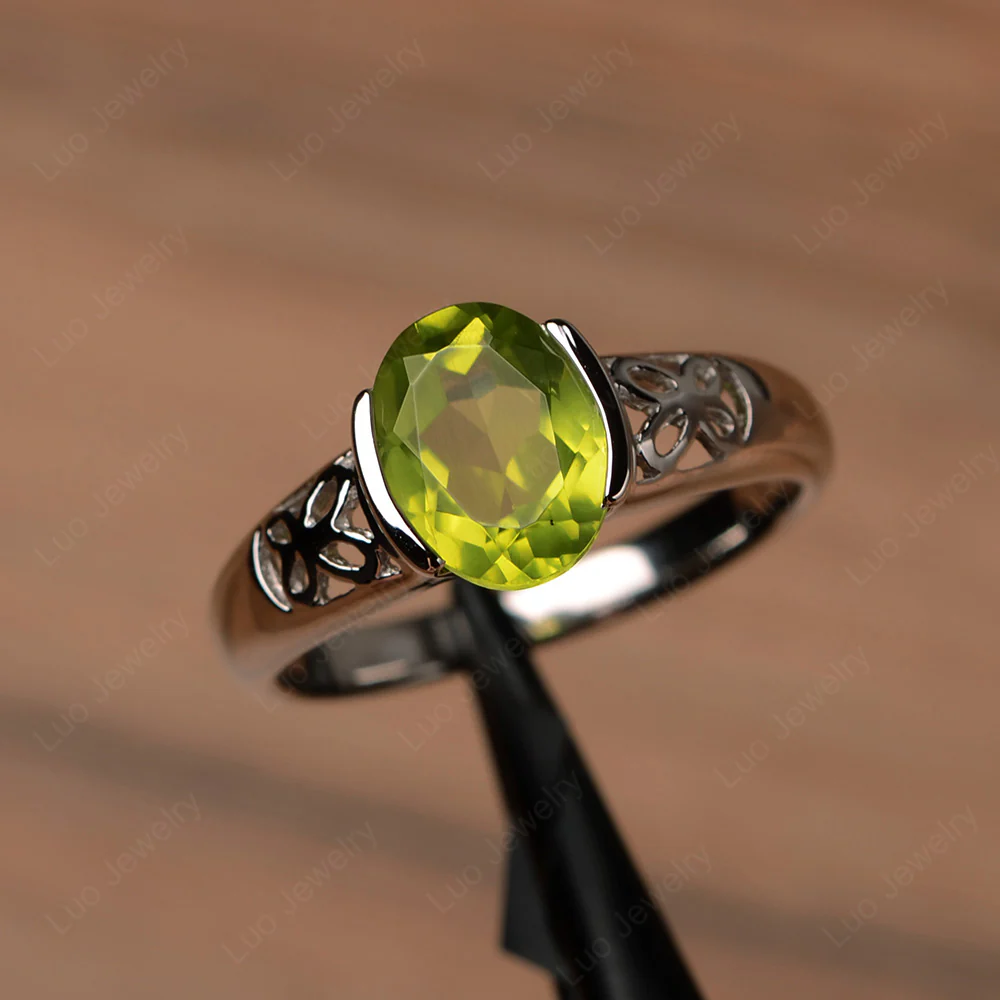 Oval Peridot Bezel Set Engagement Ring
