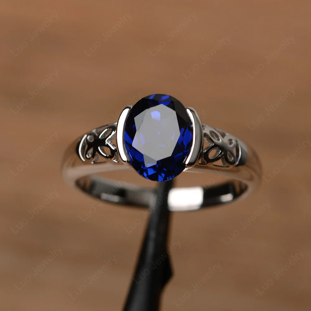 Oval Sapphire Bezel Set Engagement Ring