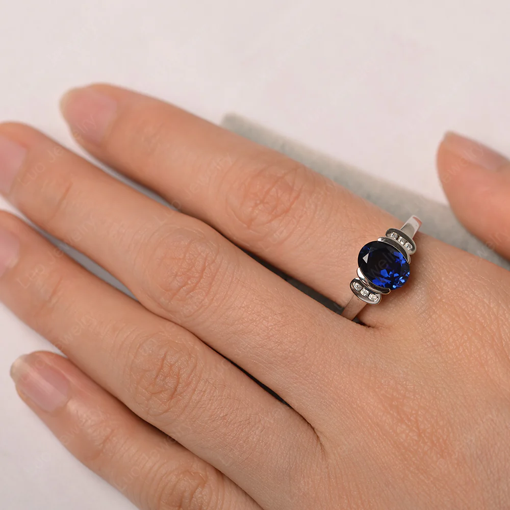 Oval Sapphire Half Bezel Engagement Ring - Image 6