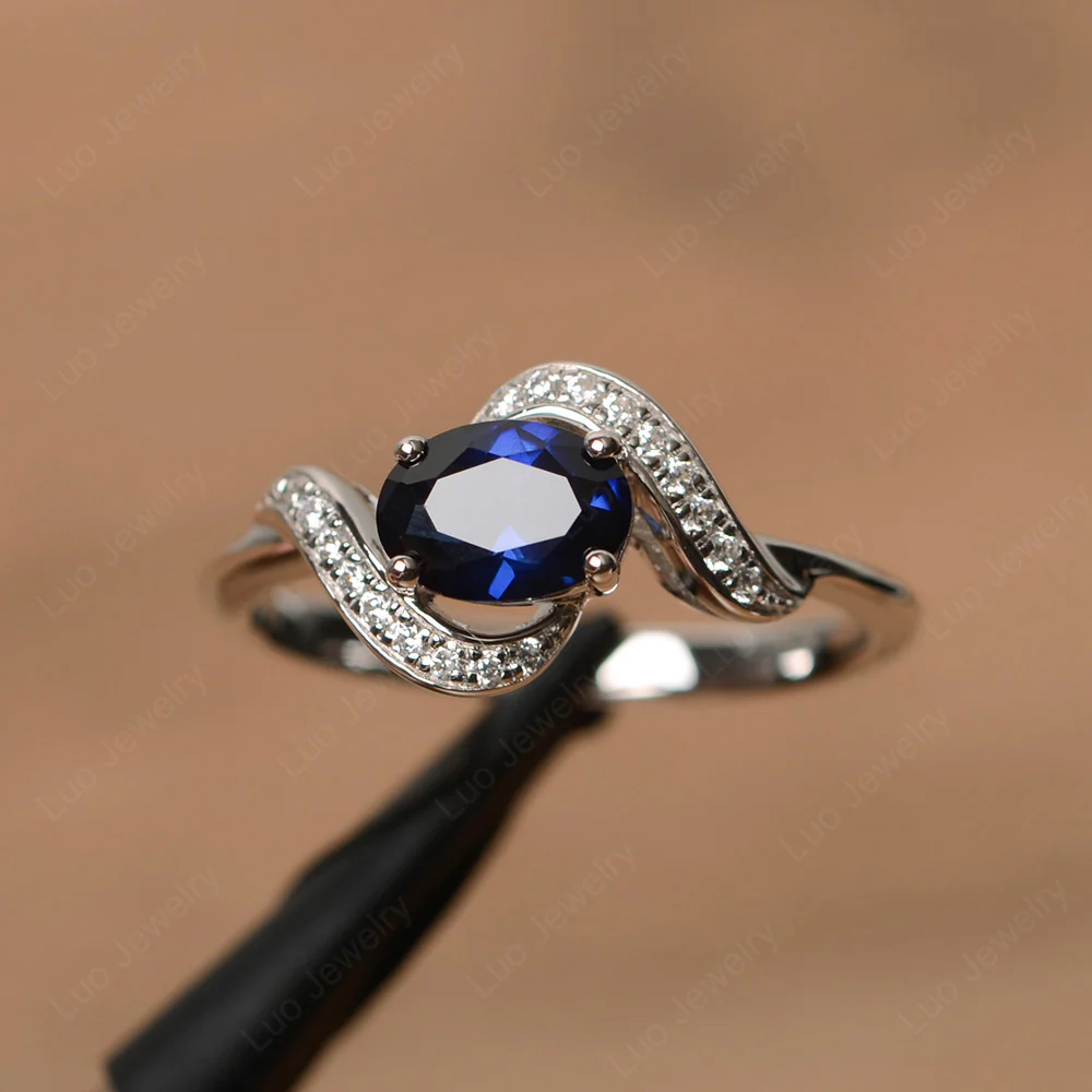 Oval Sapphire East West Engagement Ring