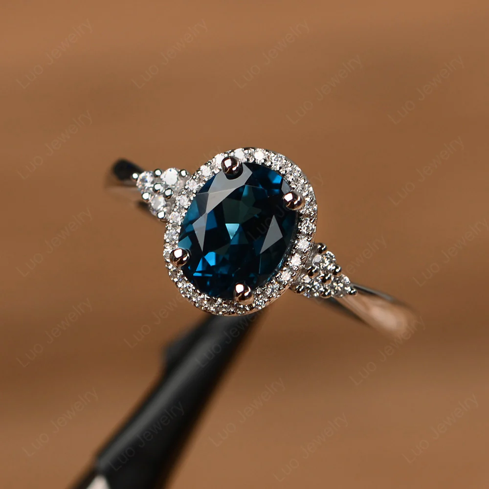 Oval Shaped London Blue Topaz Halo Engagement Ring