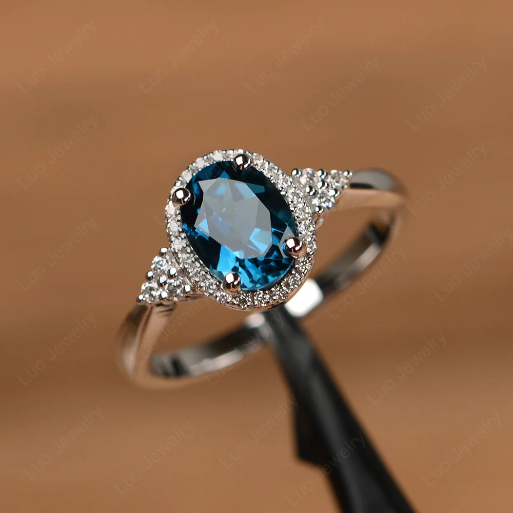 Oval Shaped London Blue Topaz Halo Engagement Ring - Image 2