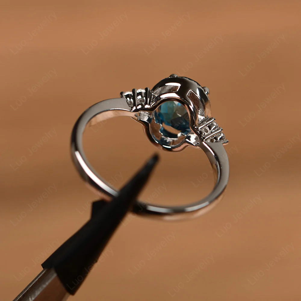 Oval Shaped London Blue Topaz Halo Engagement Ring - Image 3