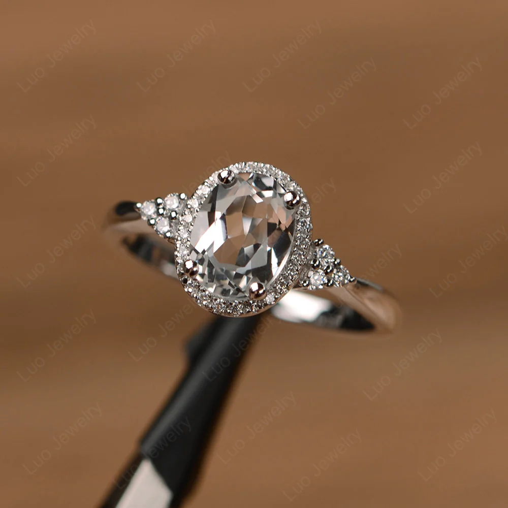 Oval Shaped White Topaz Halo Engagement Ring