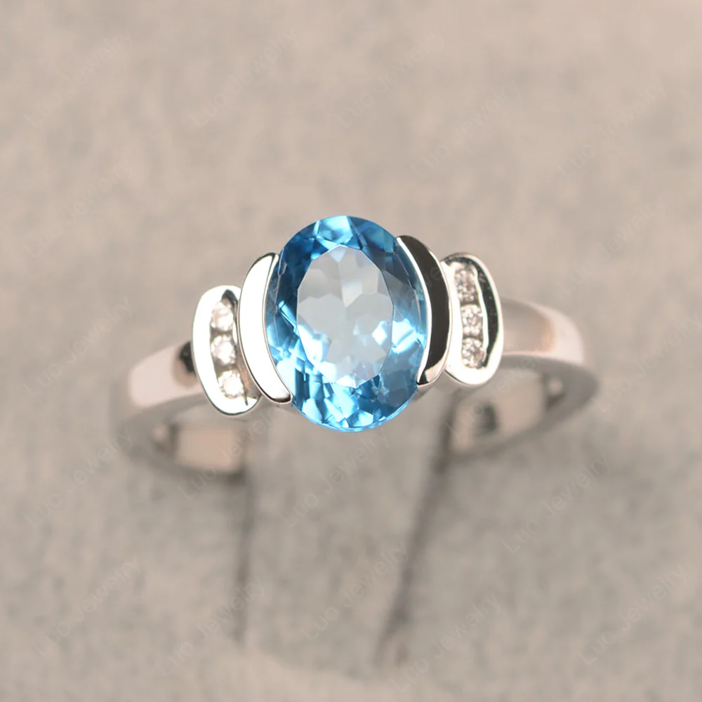 Oval Swiss Blue Topaz Half Bezel Engagement Ring
