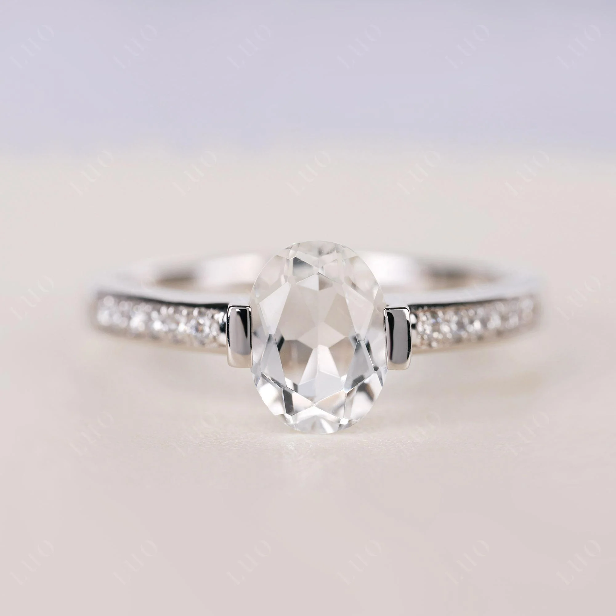 Oval White Topaz Engagement Ring Half Bezel Set