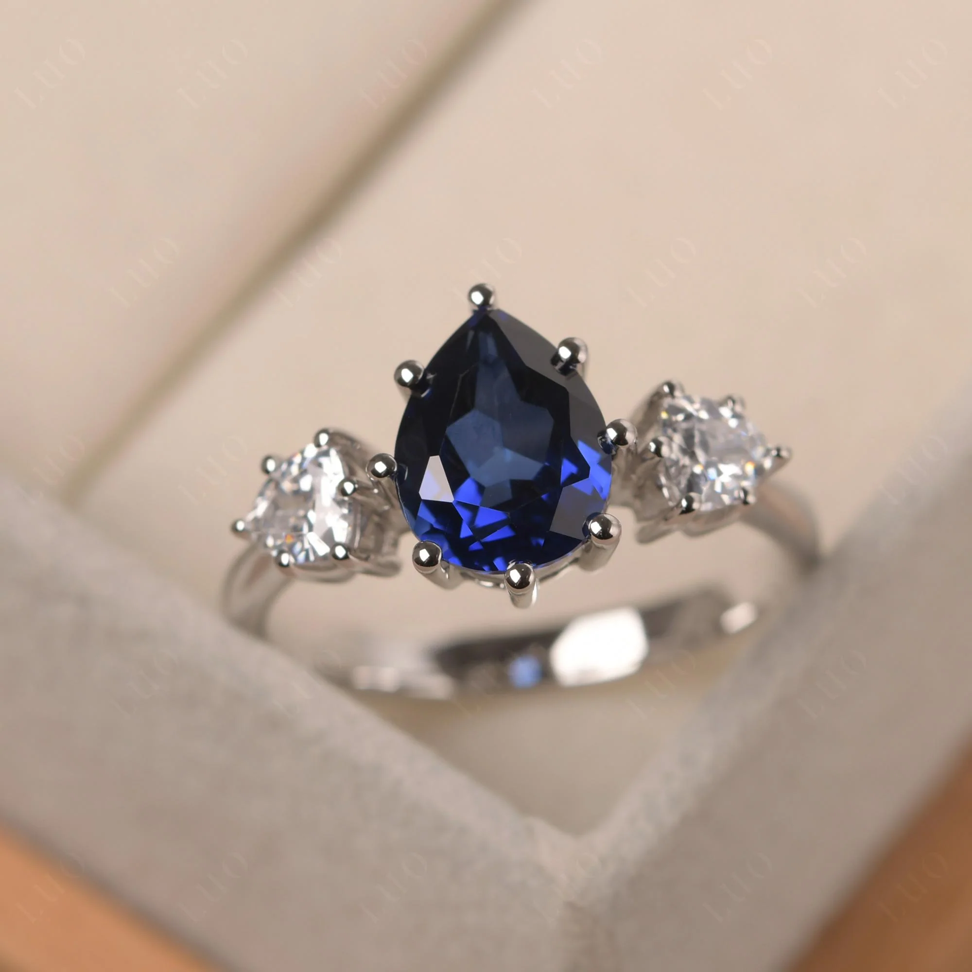 Pear Sapphire Ring with Trillion Side Stone - Image 29