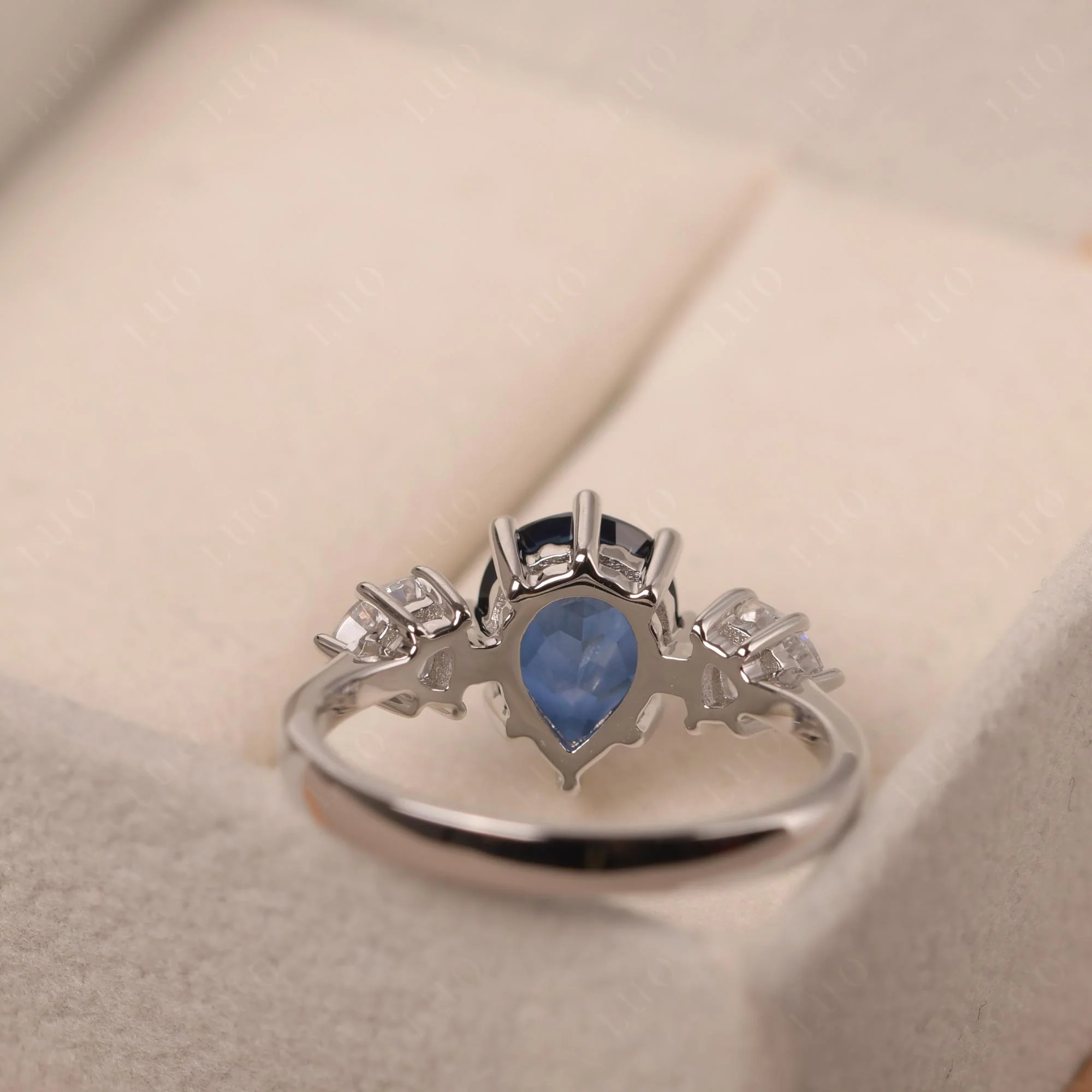 Pear Sapphire Ring with Trillion Side Stone - Image 31