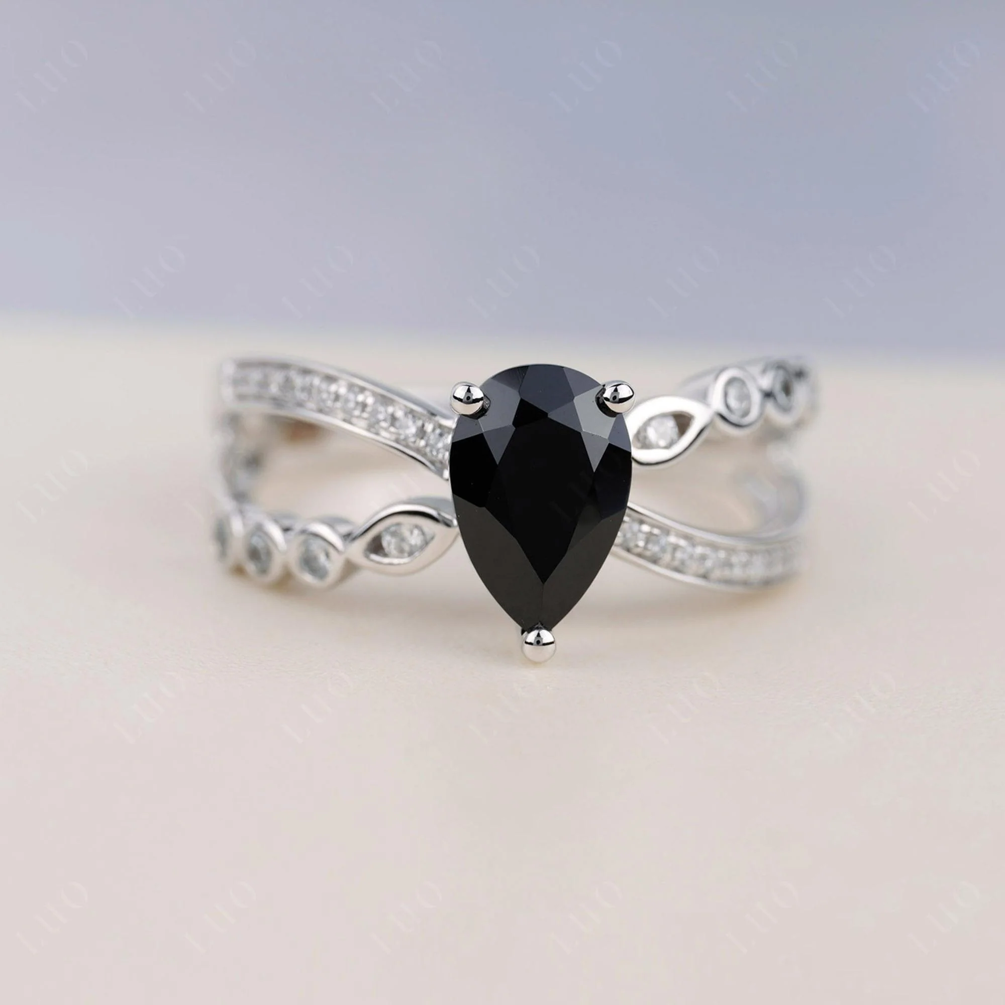 Pear Shaped Black Spinel Crossover Ring