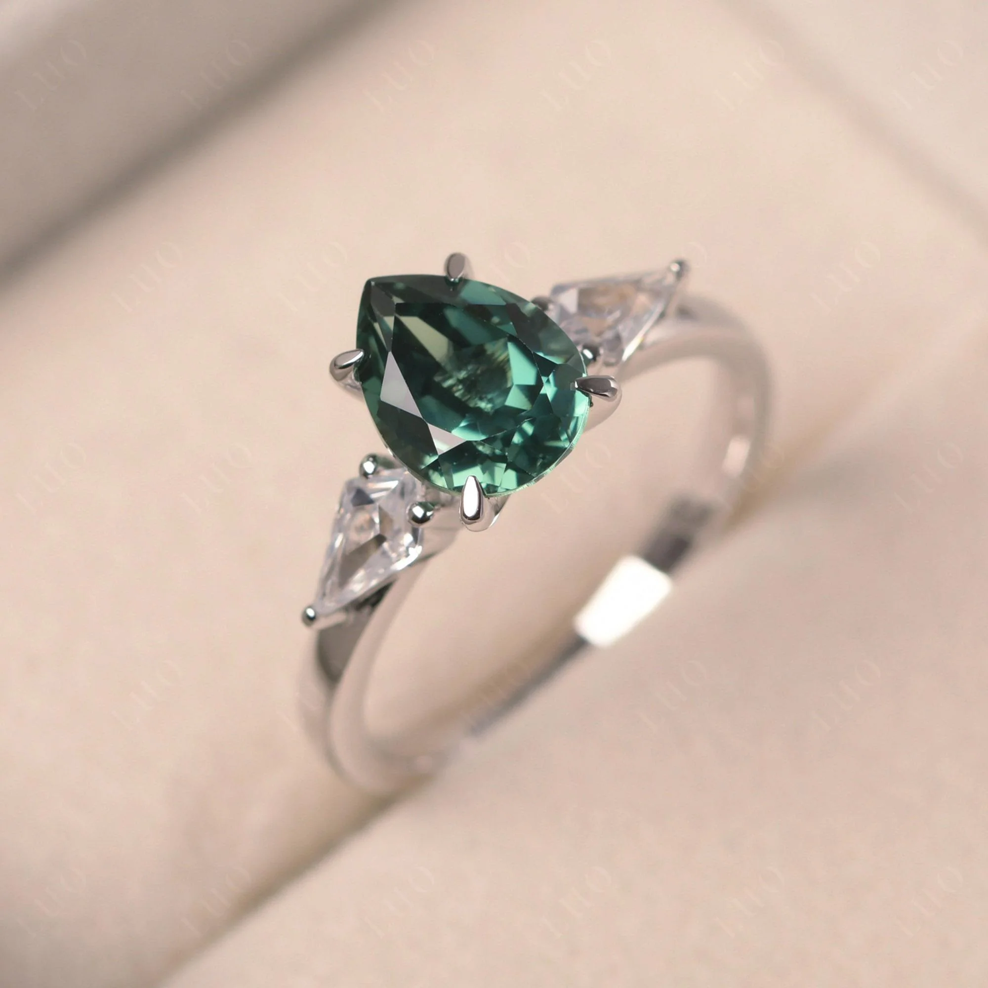 Pear Green Sapphire Trilogy Engagement Ring