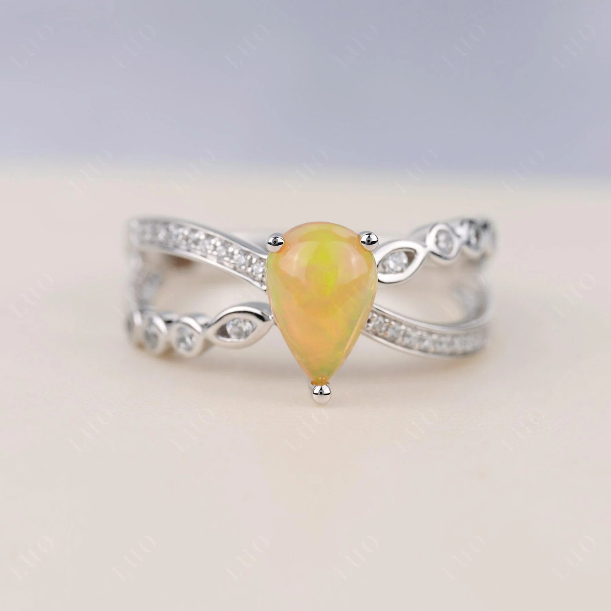Pear Shaped Opal Crossover Ring
