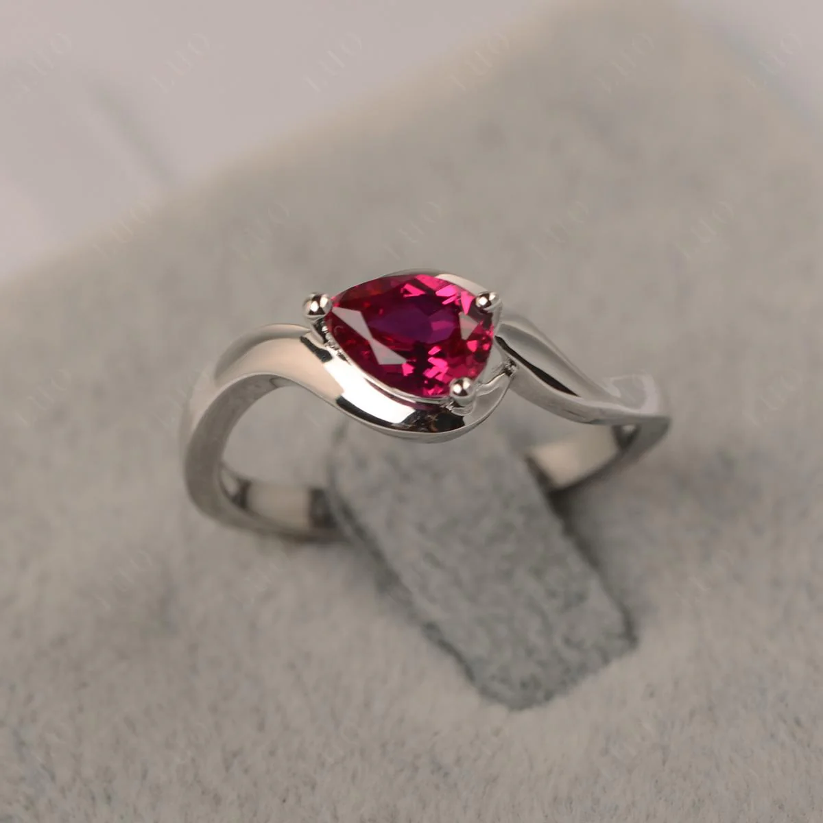 Pear Shaped Ruby East West Solitaire Ring - Image 10