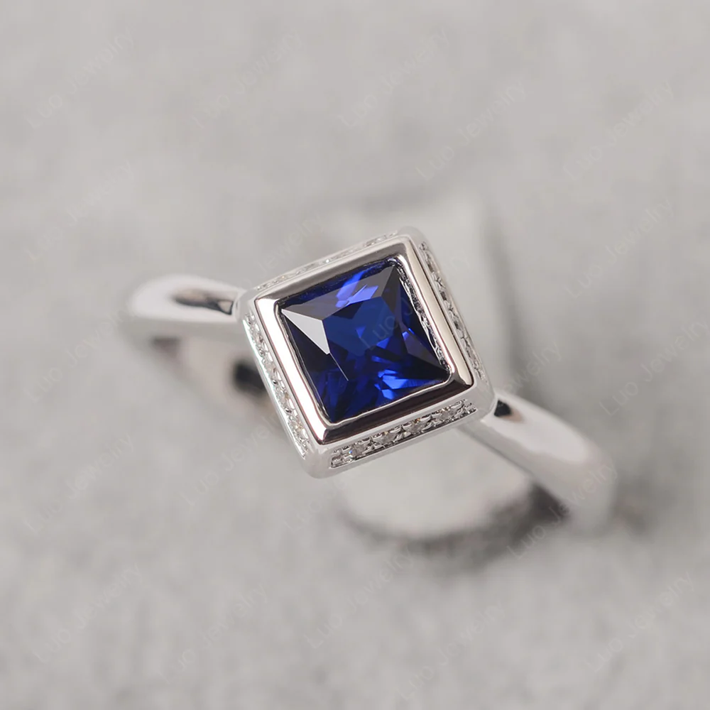Sapphire Bezel Halo Engagement Ring