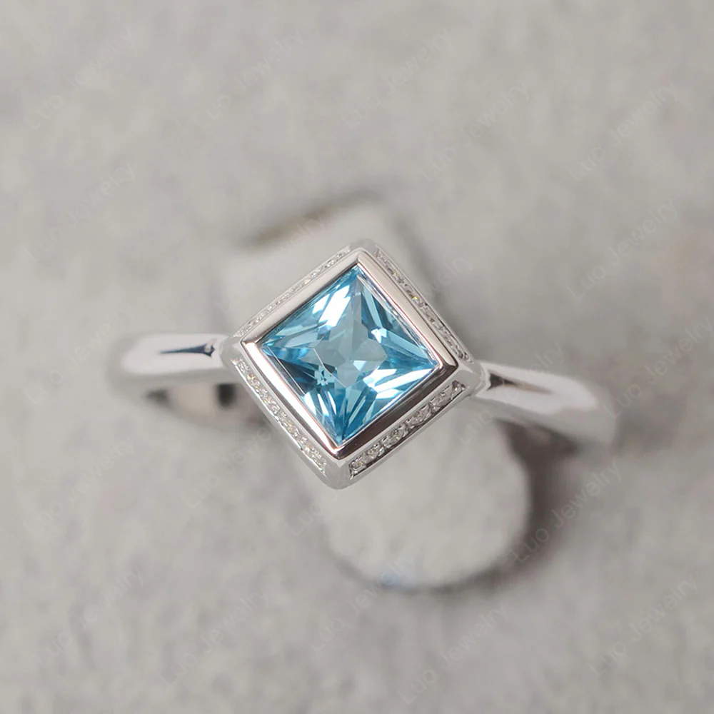 Swiss Blue Topaz Bezel Halo Engagement Ring