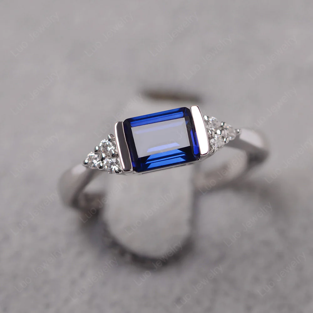 Sapphire East West Half Bezel Set Ring