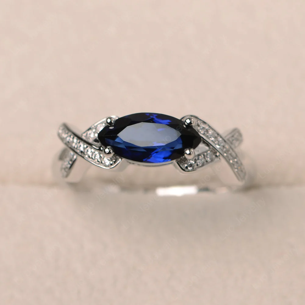 Sapphire East West Criss Cross Ring
