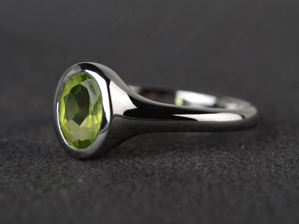 Simple Oval Bezel Set Peridot Ring - Image 2