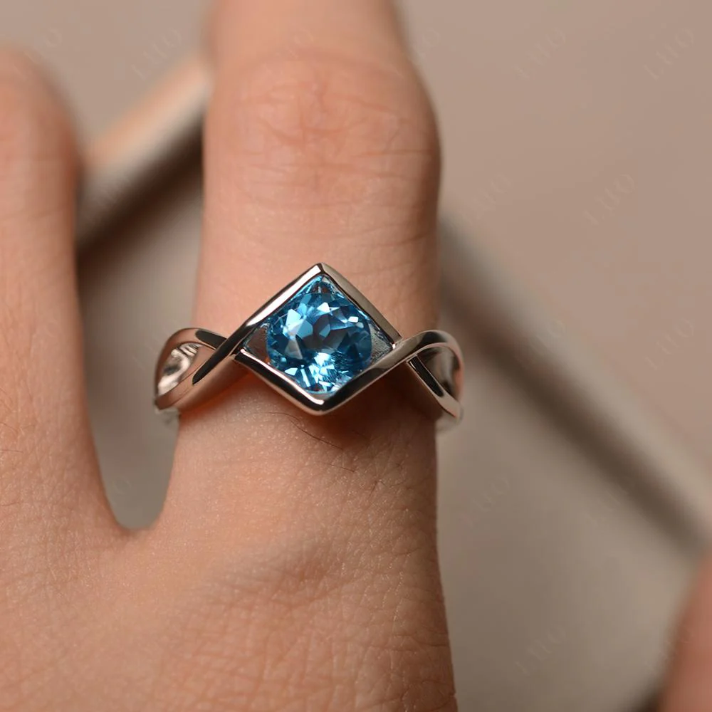 Swiss Blue Topaz Bezel Set Infinity Solitaire Ring - Image 13