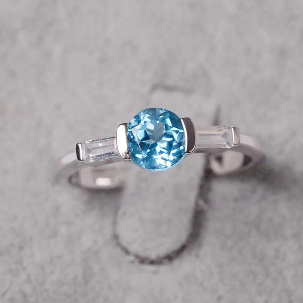 Swiss Blue Topaz Ring Round Cut with Baguette Side