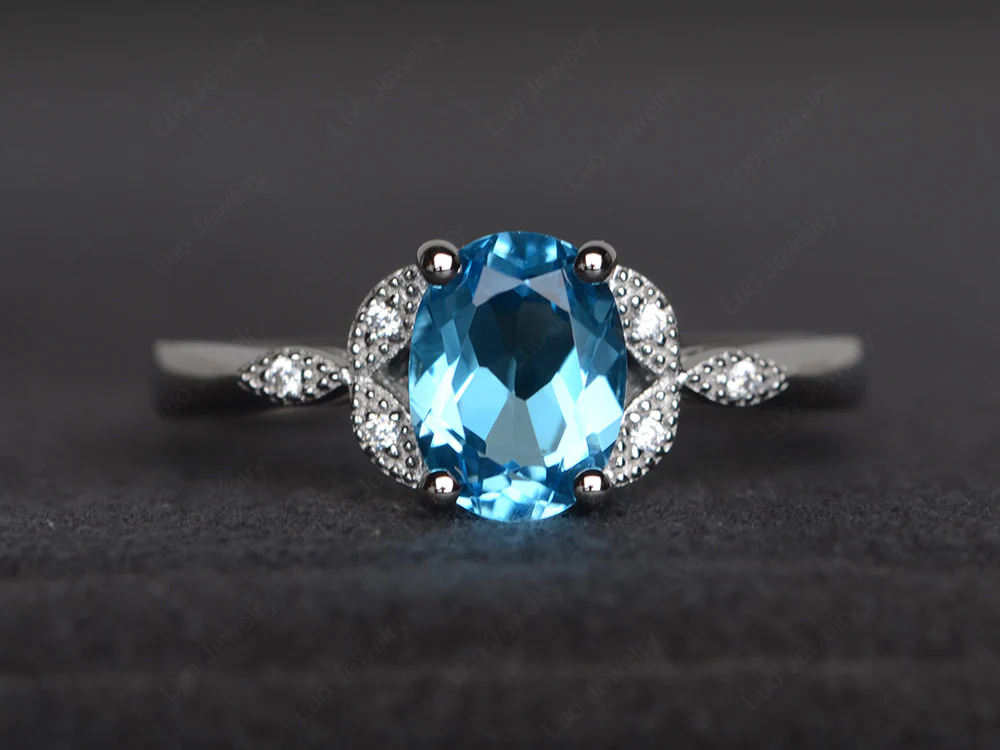 Oval Swiss Blue Topaz Leaf Engagement Ring