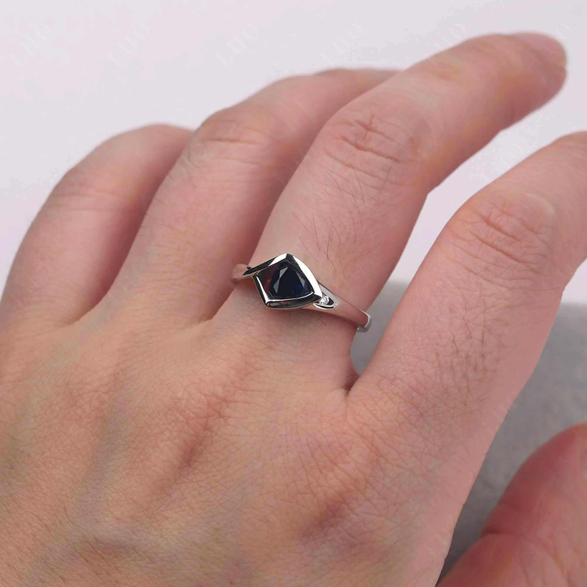 Trillion Cut Simple Sapphire Ring - Image 14