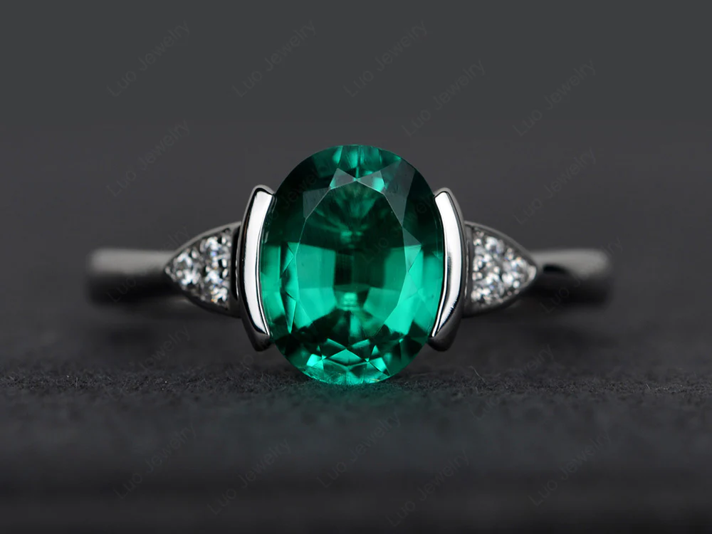 Oval Emerald Half Bezel Set Ring