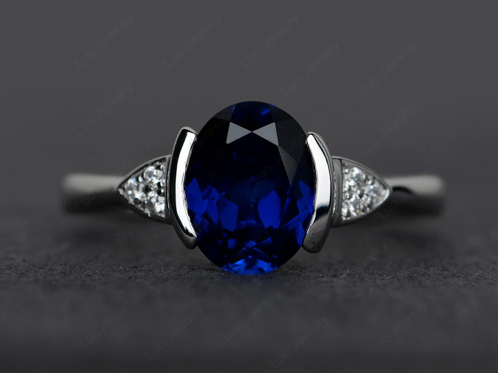 Oval Sapphire Half Bezel Set Ring