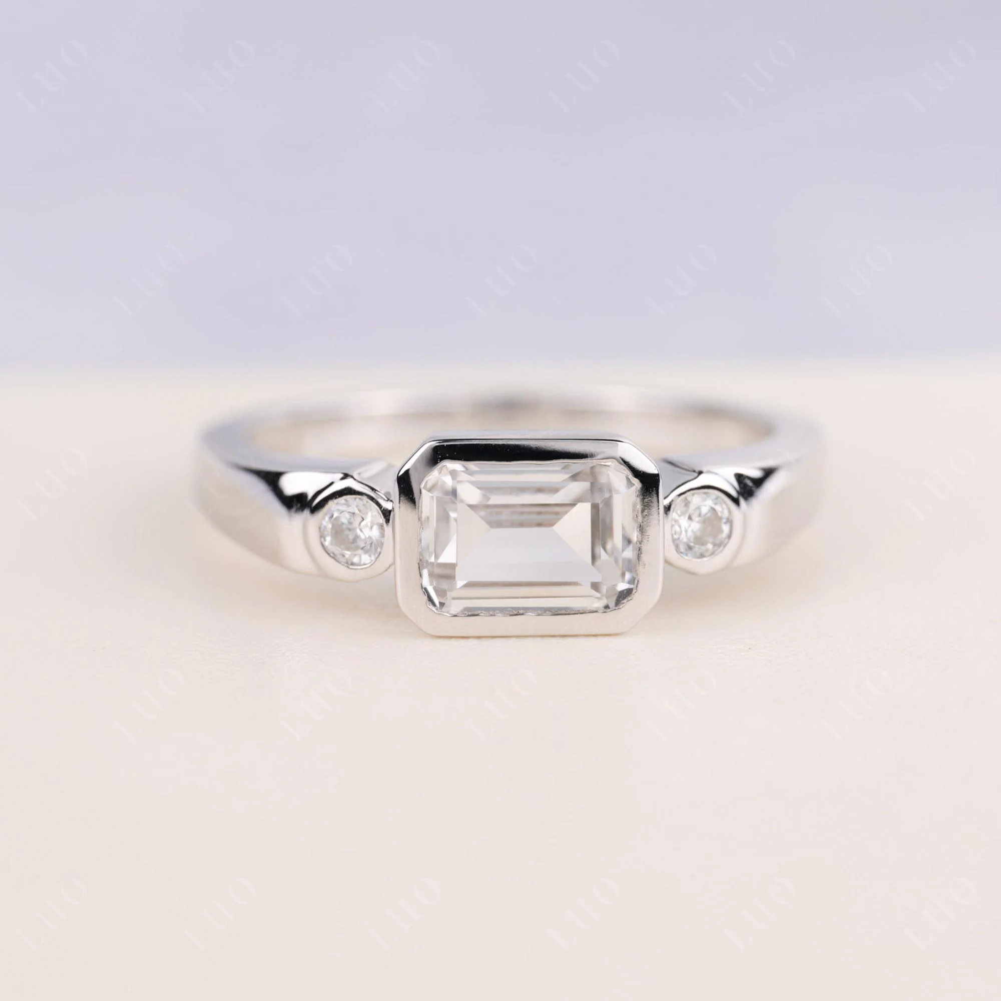 White Topaz Bezel Emerald Cut Ring